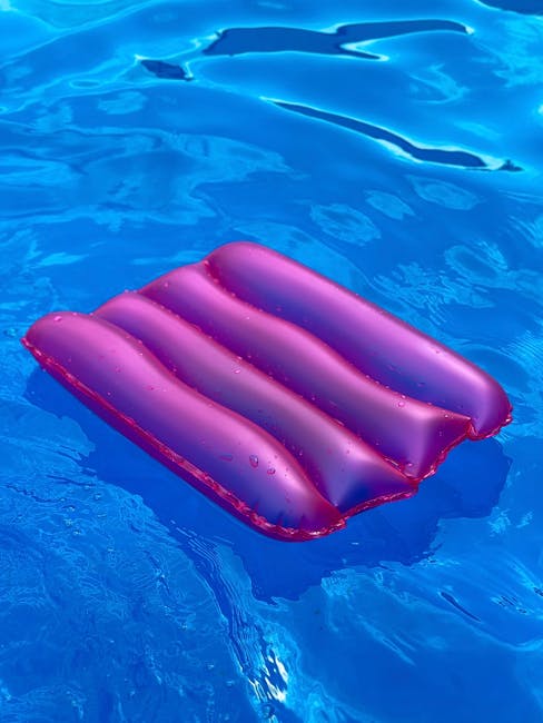 California pool at sunset reflecting calm water and golden sky